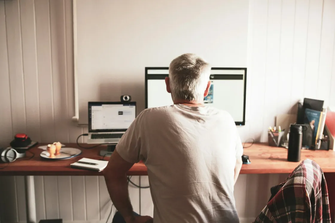 Employee working from home at a desk setup, illustrating remote work rights, hybrid work, and work from home policy in 2026.